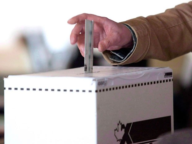 Lawrence Solomon: The need to up our game in how we elect our leaders, a concern that now seems abstract, could soon become essential to protect our democracy precisely because of electronic voting — Elections Canada plans its first pilot projects next year. THE CANADIAN PRESS/Chris Young.
