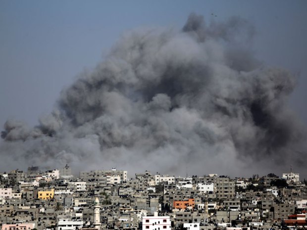 Above, smoke from an Israeli strike rises over the Gaza Strip, Friday, July 25, 2014. 